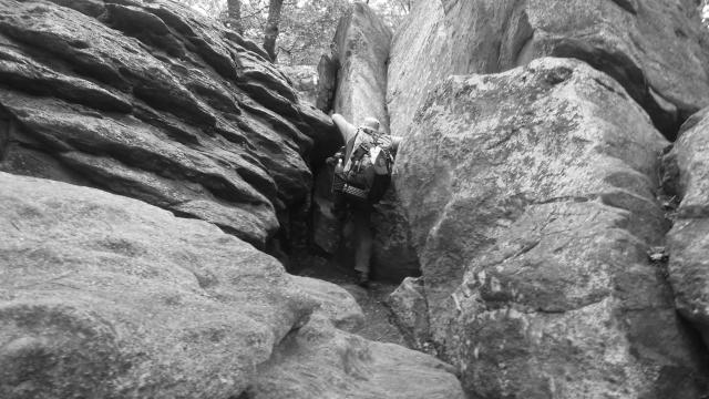 Stick climbing over rocks