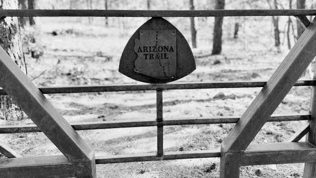 A rusty steel gate on the Arizona Trail