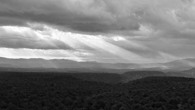 Sunlight streams through storm clouds