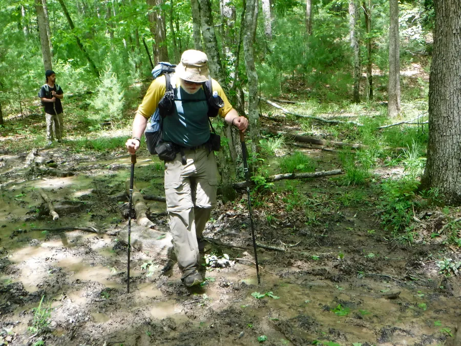 Walking carefully on muddy trail
