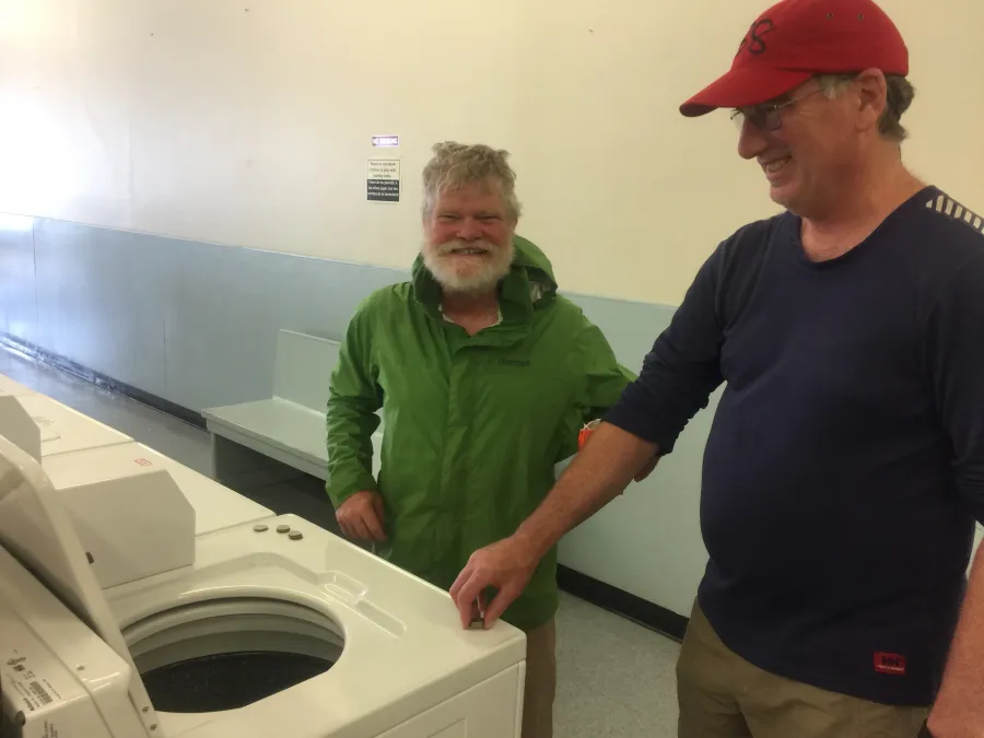 Stick and Mike in a laundromat