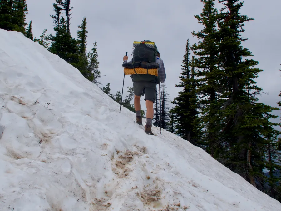 Ralph crosses snow on a steep slope