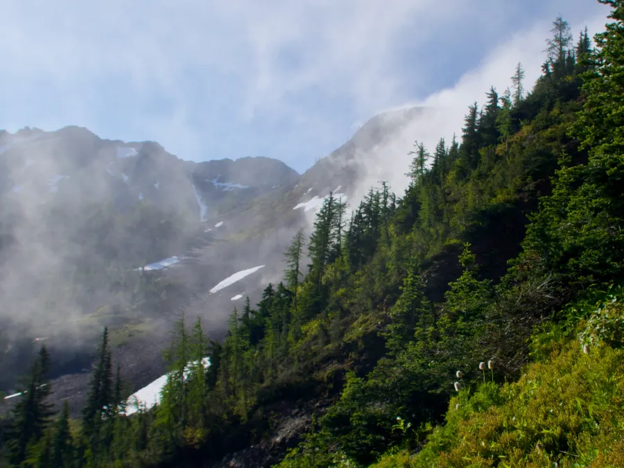 Following the trail below the clouds