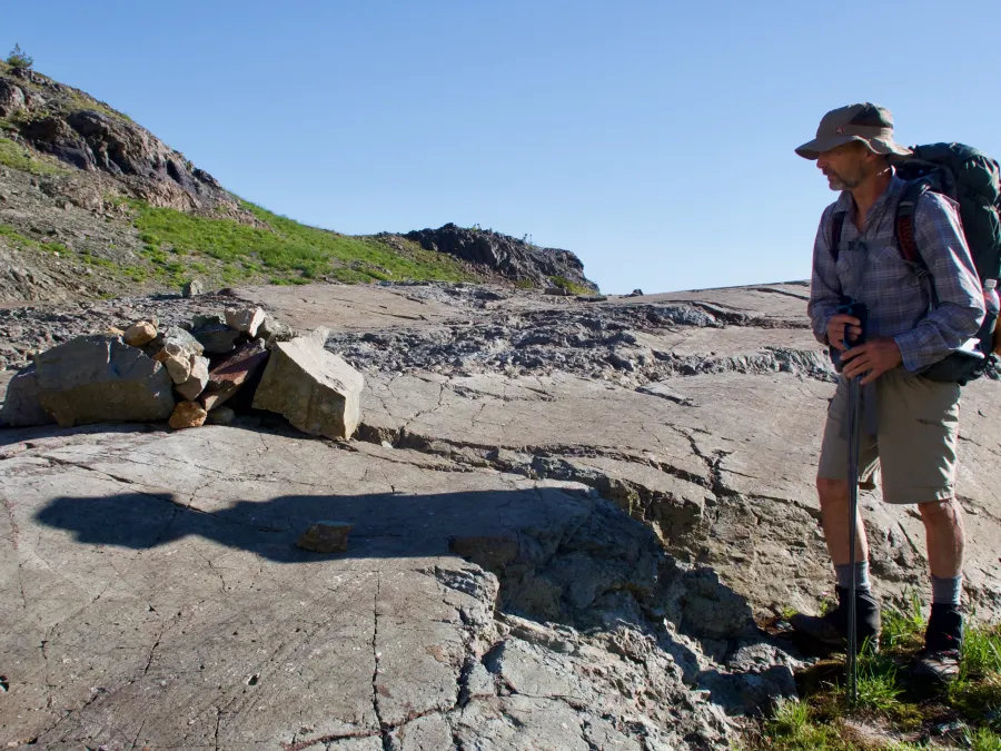 Ralph looks a rocks scraped by a glacier