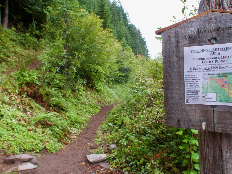 A sign warns of camping restrictions