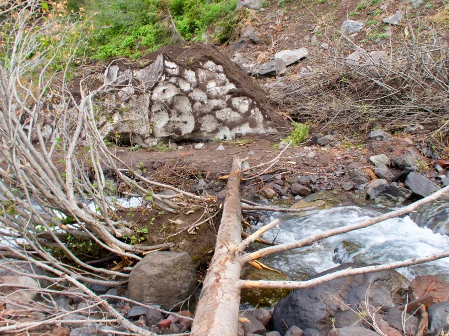 A pile of snow looks like a rock at Milk Creek