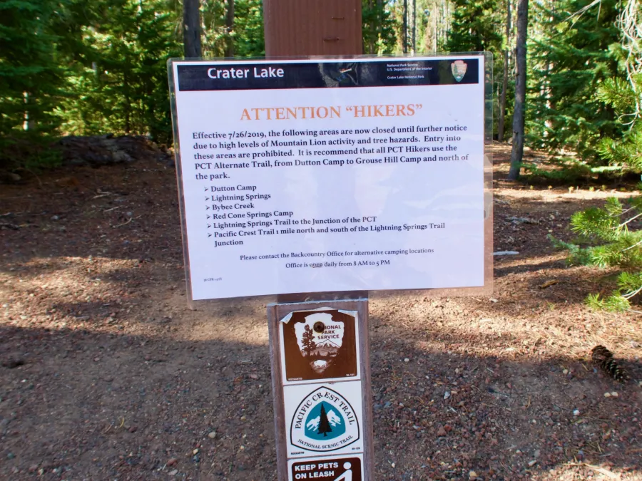 A sign warning of a trail closure in Crater Lake National Park