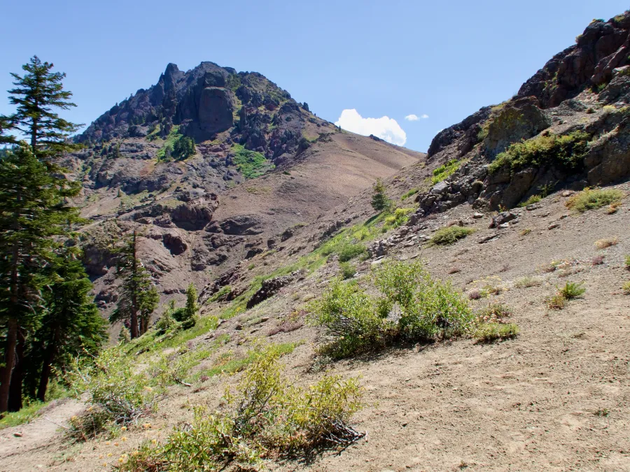 The trail climbs volcanic mountains