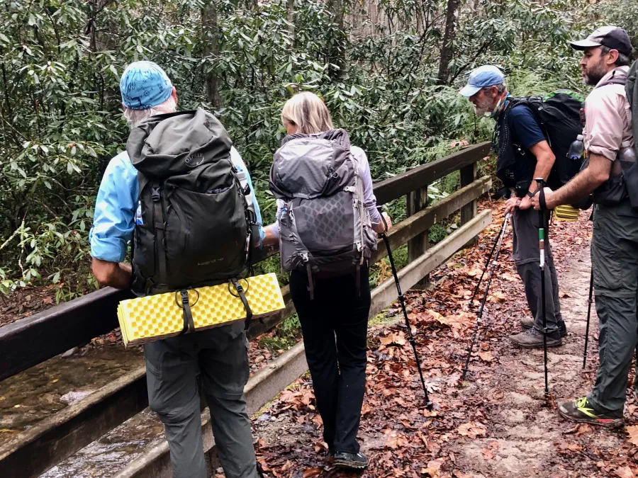 Joe, Mary, Tengo Hambre, and Just Awesome pause at a bridge