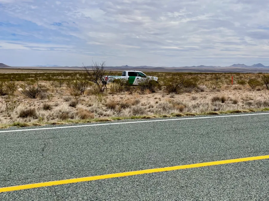 A U.S. Border Patrol truck drives by