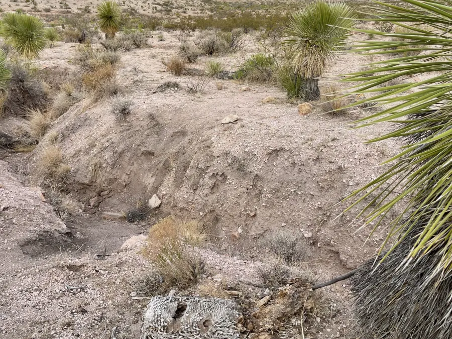 A trench across the trail