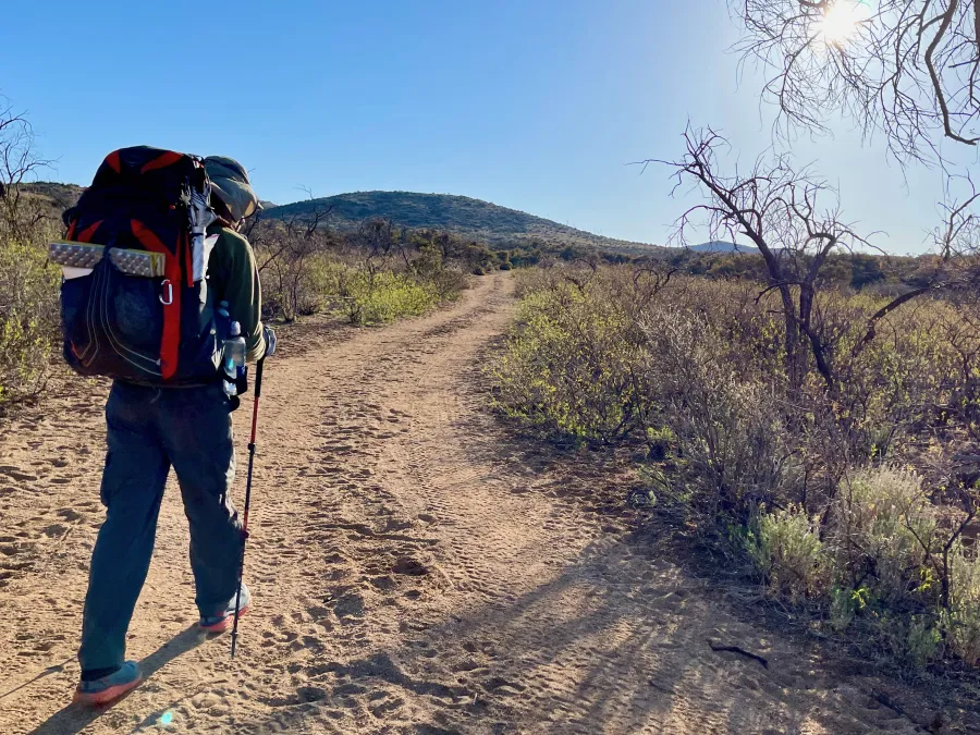 Walking up a sandy road