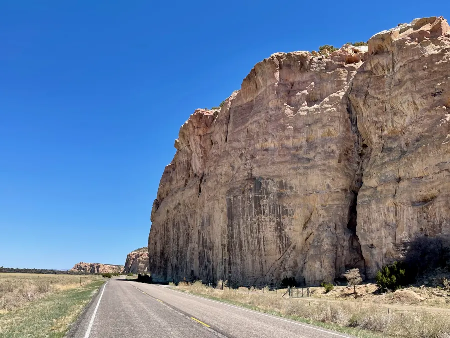 NM 117 passes a large sandstone bluff