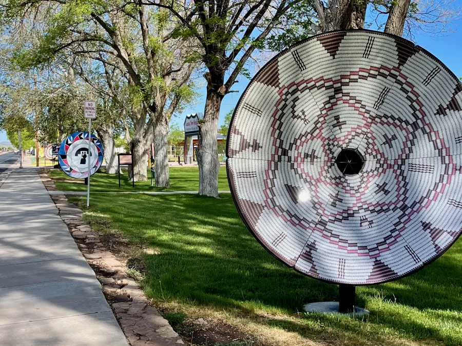 Satellite dishes that were painted to look like Native American baskets and pottery bowls