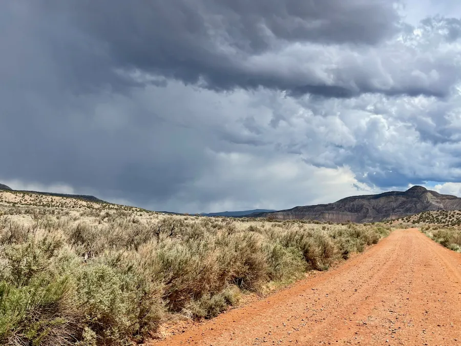 A storm rises in the distance
