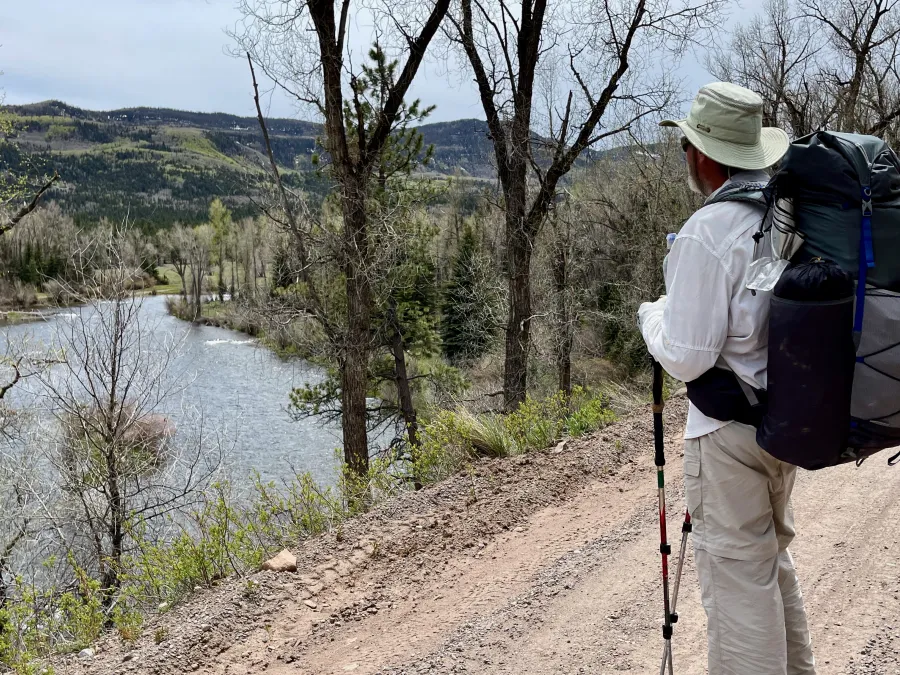 Top O' stops to look at the Conejos River