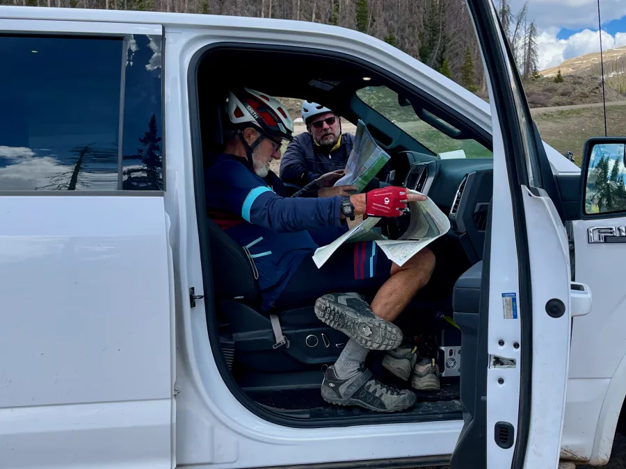 Great Divide bicyclists look at a map
