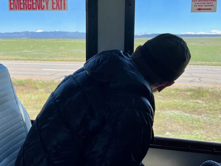 Top O' looks at mountains from a bus window