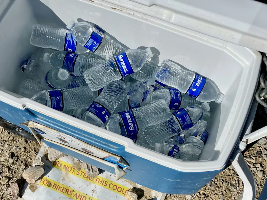 A cooler of water bottles