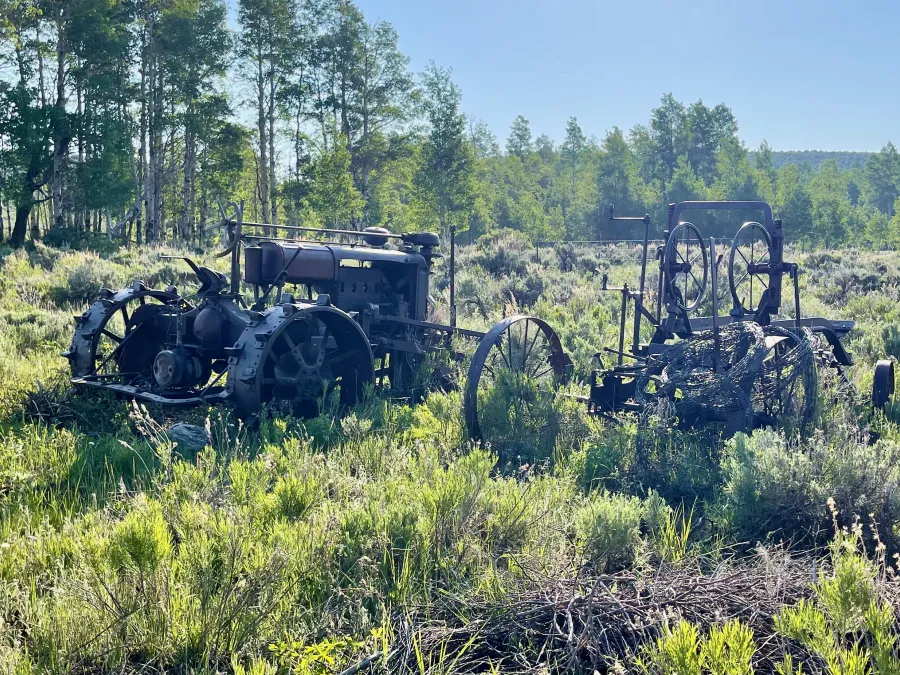 Old machinery sits rusting in a field