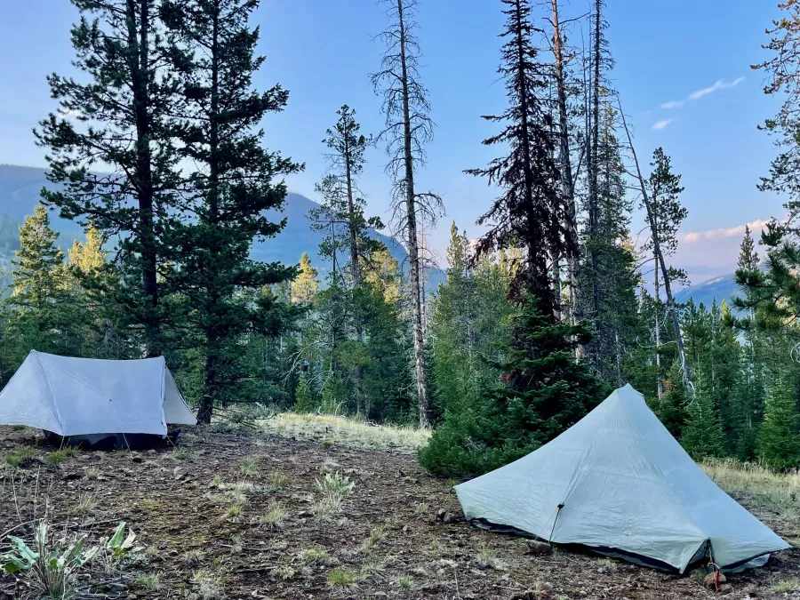 Tents pitched on a sloping ledge