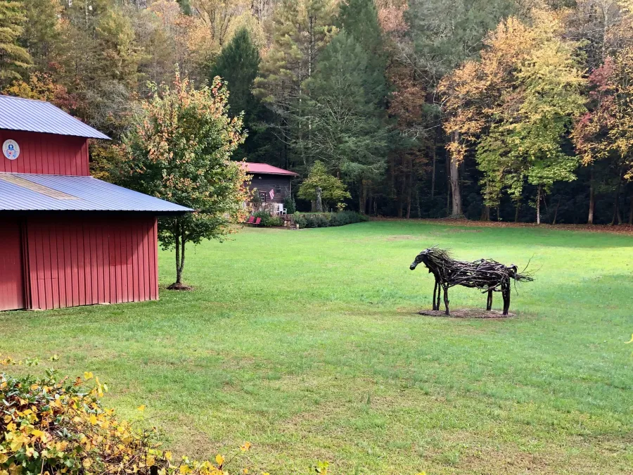 A fake horse in a farm field