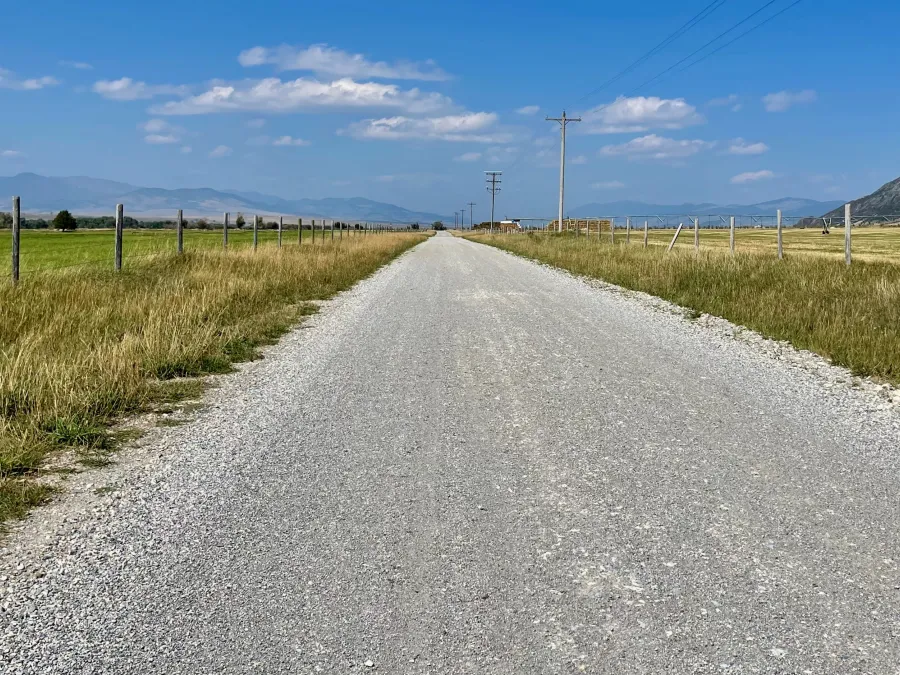 A gravel road appears to stretch to infinity