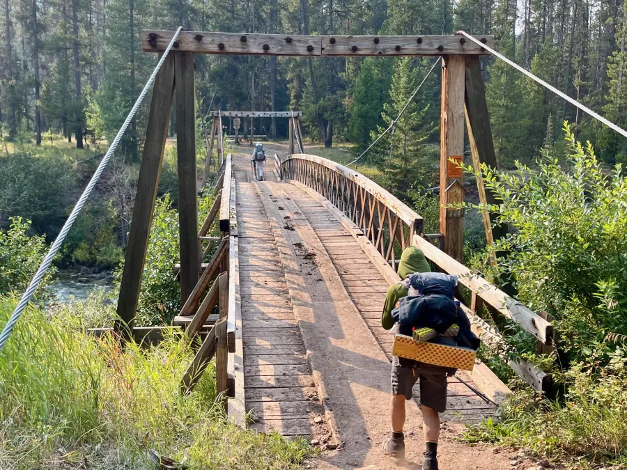 Crossing the South Fork Sun River near Benchmark Trailhead