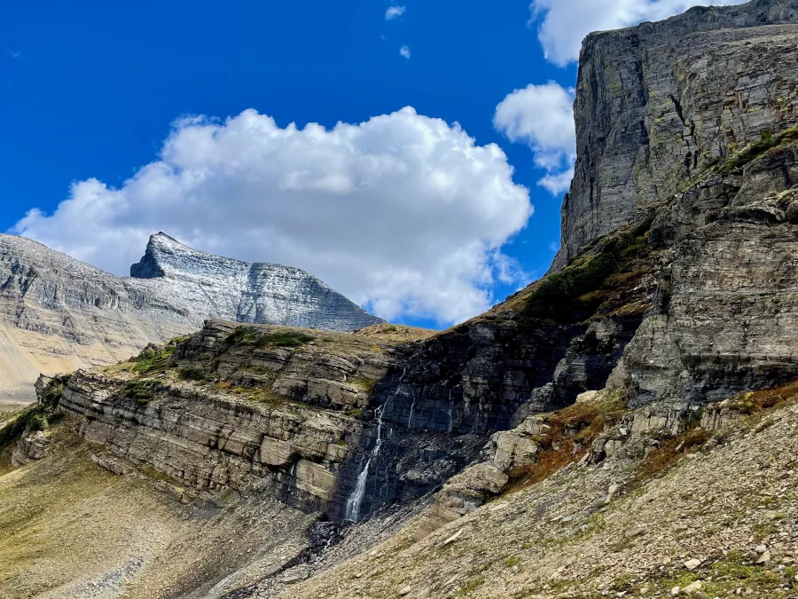A waterfall at the side of a valley
