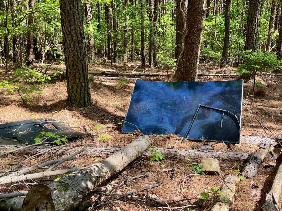 A TV dumped next to the trail