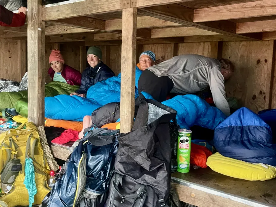 Hikers huddled together in Bald Mountain Shelter