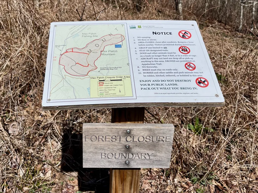 A sign with a map showing a closure area