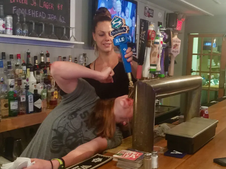 Guzzling beer from a tap