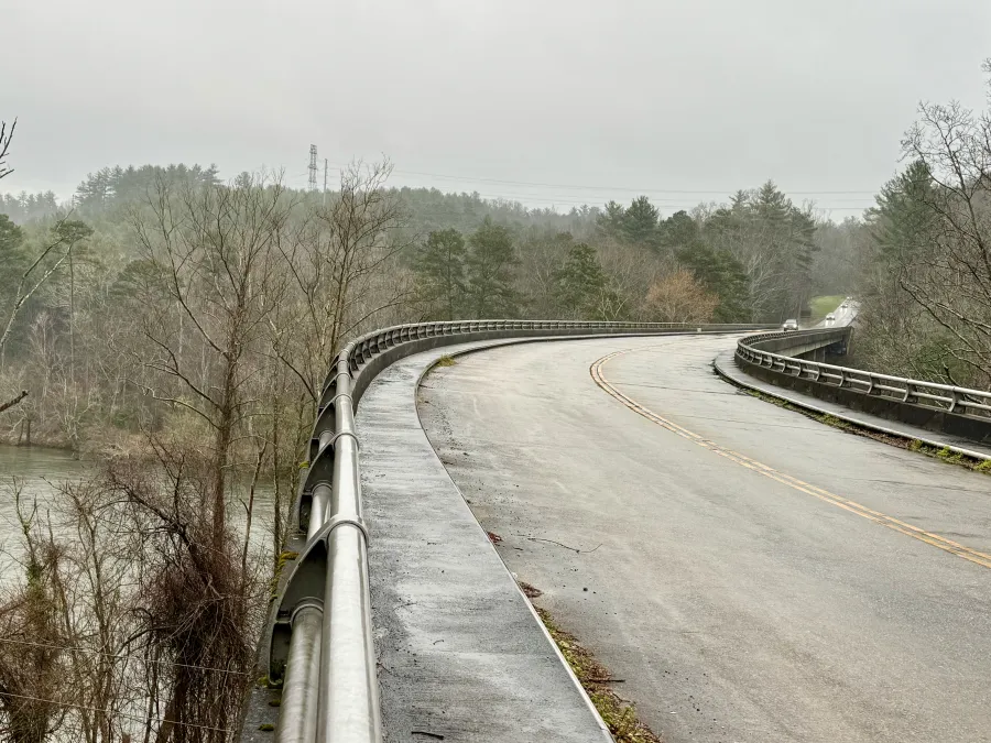 A parkway bridge crosses the French Broad River