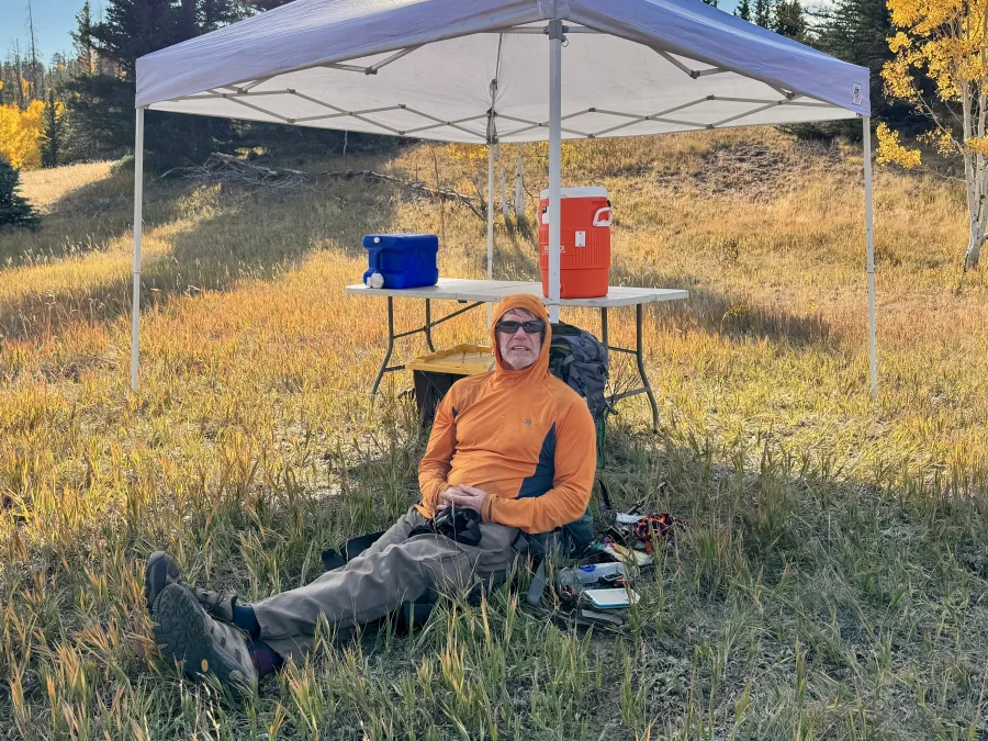 Robert relaxes in the shade of a canopy