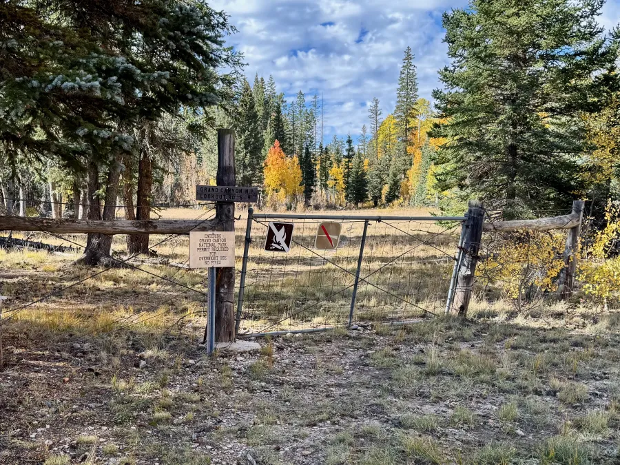 A fence and gate at the boundary of Grand Canyon National Park