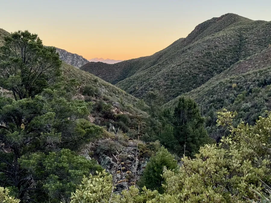 The Four Peaks lit by the setting sun