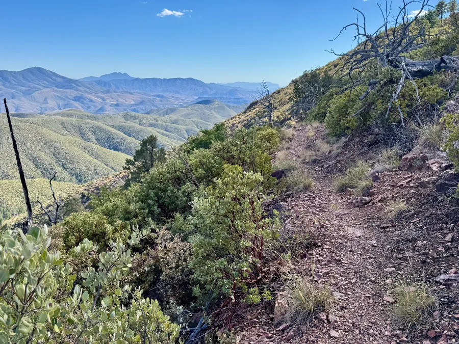The trail goes around a mountain