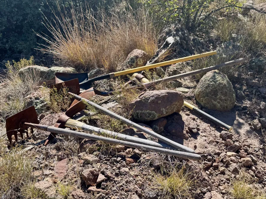 A stack of tools used for trail maintenance