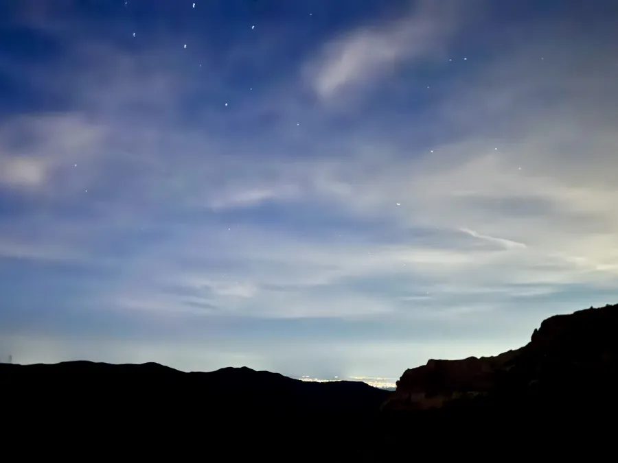 Lights from Mesa, Arizona illuminate the sky