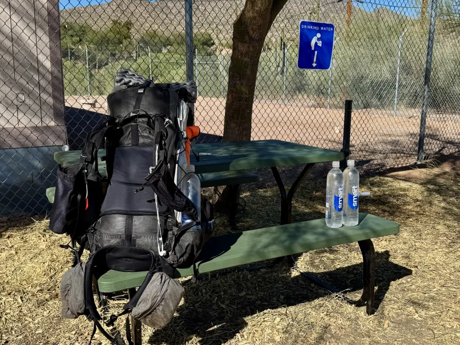 A spigot and picnic table provided for hiker