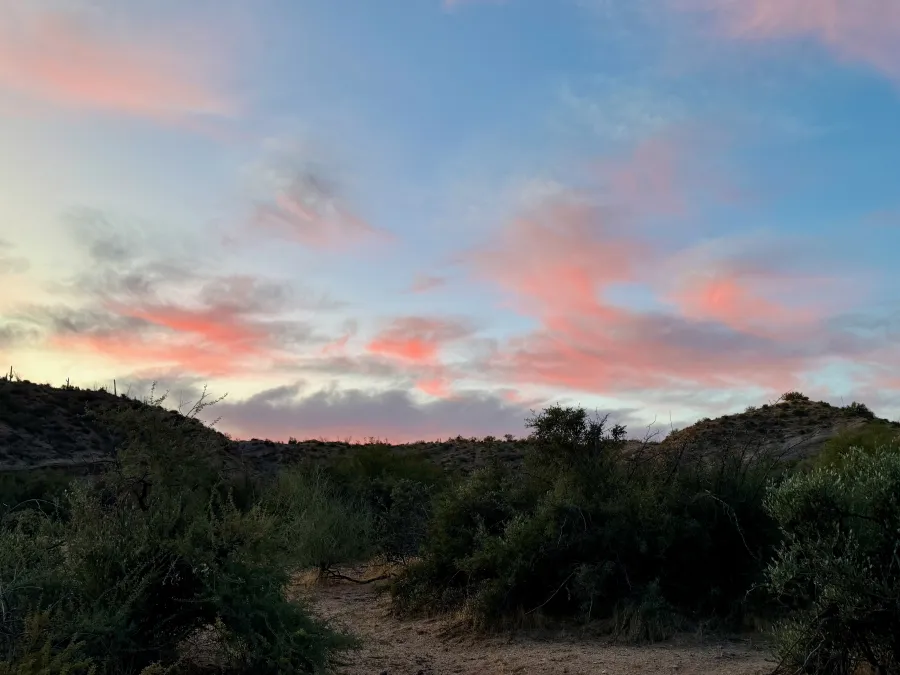 A few puffy clouds at dawn