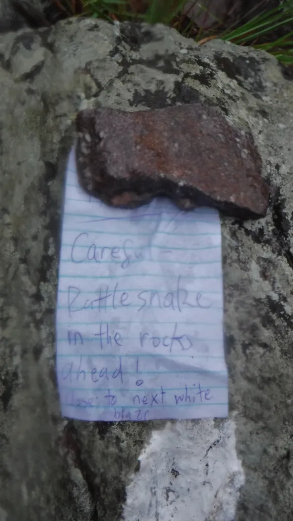 Note warning about a rattlesnake