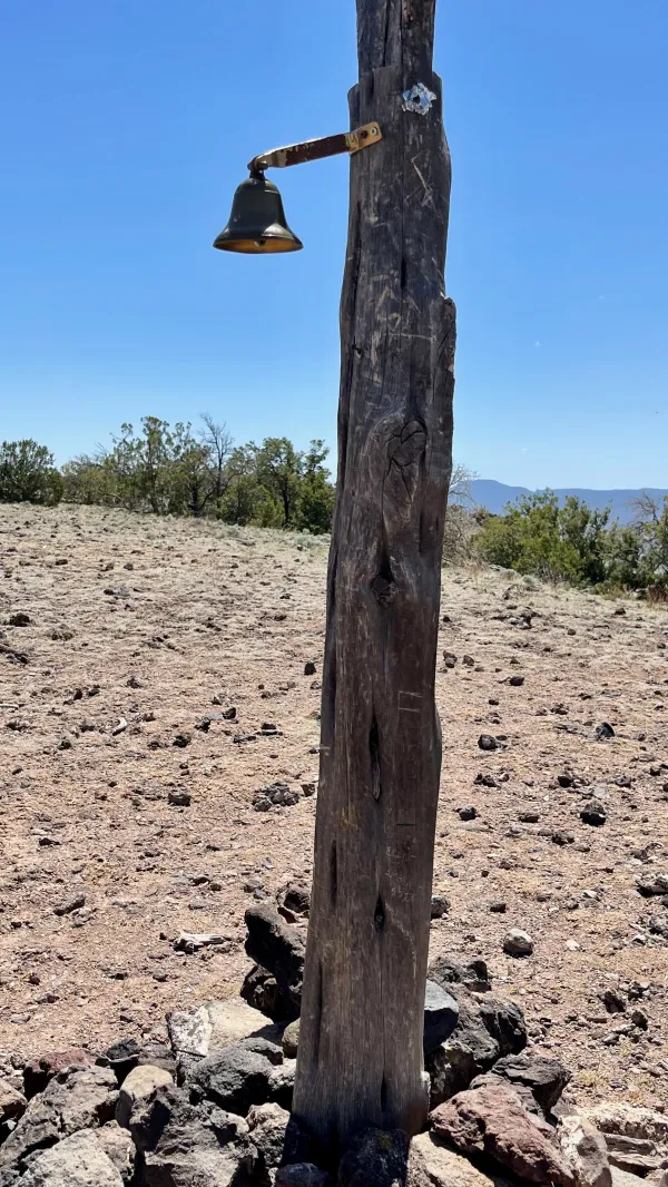 A bell hung on a post