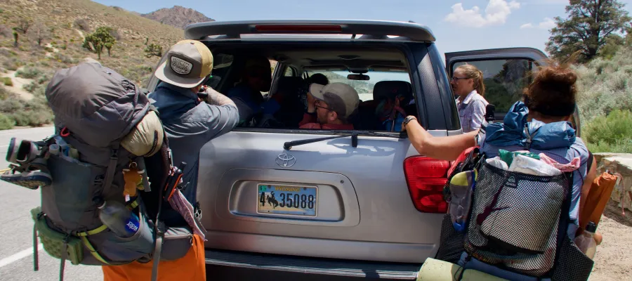 Climbing into shuttle driver's car at Walker Pass