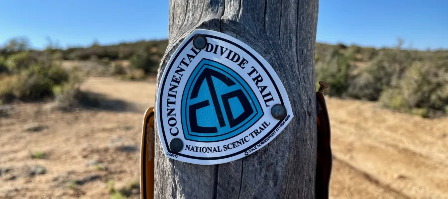 A CDT sign nailed to a post