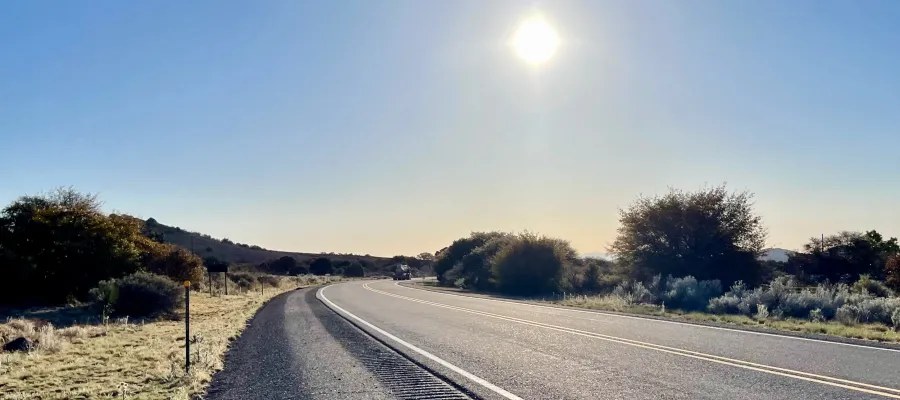 The sun shines over State Route 90