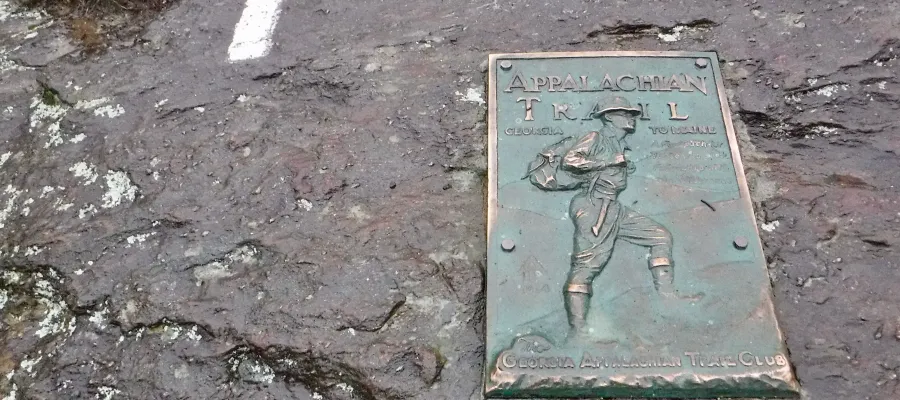 A plaque and the first blaze on Springer Mtn.