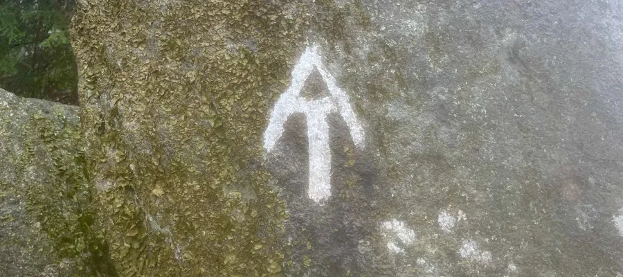 AT painted on a rock