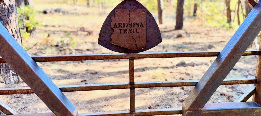 A rusty steel gate on the Arizona Trail